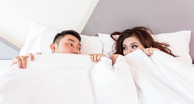 asian couple bed